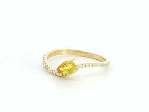Elegant bypass ring with yellow sapphire and pave diamonds