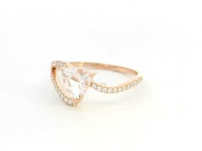 Morganite diamond twist ring in 18K rose gold with pavé band
