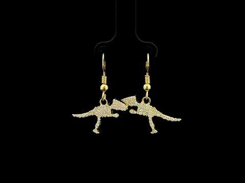 Diamond dinosaur dangle earrings in 18K yellow gold featuring sculptural dinosaur silhouettes set with round brilliant diamonds.