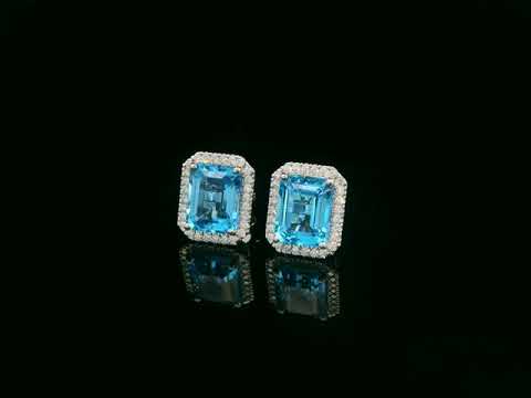 Swiss blue topaz and diamond stud earrings in 18K white gold with emerald-cut topaz and diamond halo by Emirates Diamonds
