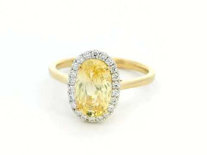 Elegant 18K Yellow Gold Ring with 3.41 Carat Oval Yellow Sapphire & Diamond Halo