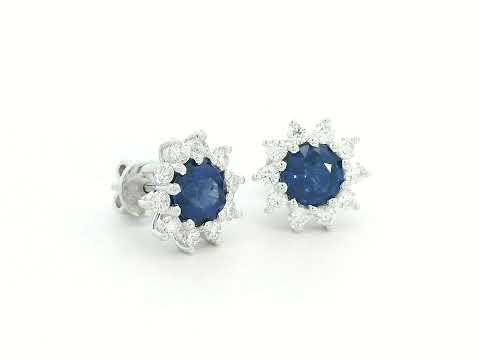 Round blue sapphire stud earrings with diamond halo in white gold