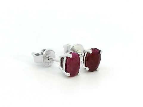 1.50 carat oval ruby stud earrings in 18K gold setting, July birthstone