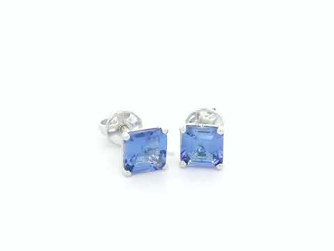 Square emerald-cut tanzanite solitaire stud earrings in 18K white gold by Emirates Diamonds.