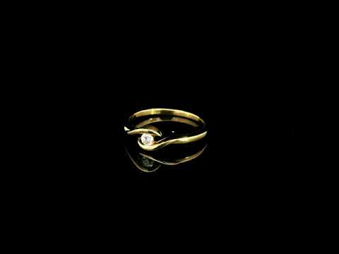 Solitaire diamond twist ring in 18K yellow gold featuring a 0.10 carat natural diamond