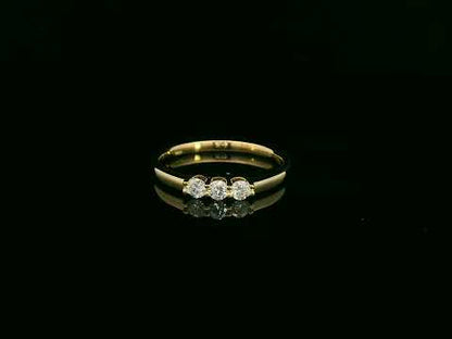 18K yellow gold diamond three-stone ring with round brilliant diamonds, classic trilogy ring design by Emirates Diamonds