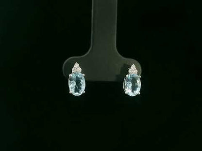 Oval aquamarine and diamond cluster earrings in 18K white gold by Emirates Diamonds