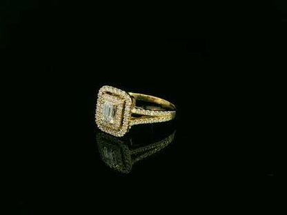 0.58 carat IGI certified emerald cut diamond halo ring in 18K yellow gold with 0.56 carat pavé diamonds by Emirates Diamonds.