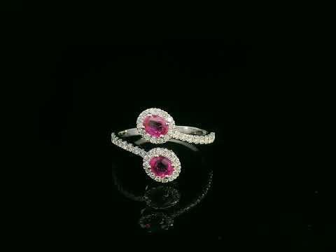 18K white gold ruby and diamond bypass ring with dual oval rubies and diamond halos by Emirates Diamonds