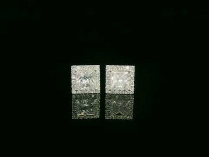 Princess cut diamond halo stud earrings in 18K white gold featuring GIA certified 1.01 carat E color VS2 diamonds with halo accents by Emirates Diamonds