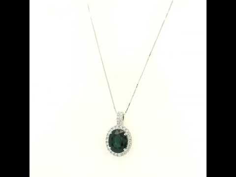 Oval sapphire and diamond halo pendant in 18K white gold with diamond-set bail