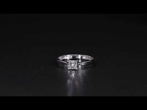 Princess cut diamond solitaire engagement ring in 18K white gold featuring a square diamond in a four-prong setting with a polished band.