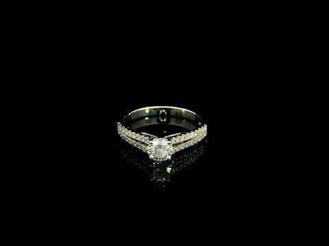 Round diamond split shank engagement ring in 18K white gold with diamond-set band