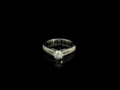 Round diamond split shank engagement ring in 18K white gold with diamond-set band