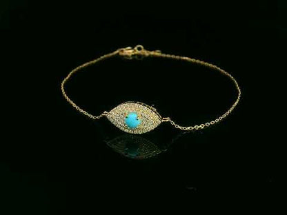 18K yellow gold turquoise and diamond evil eye bracelet – pavé diamond halo with turquoise center by Emirates Diamonds.