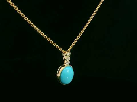 18K yellow gold pendant with 2.46ct oval turquoise and 0.14ct diamond accents.