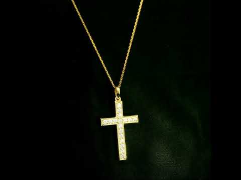 18K yellow gold Christian cross pendant with round diamonds set along the vertical and horizontal arms, shown hanging from a fine gold chain.