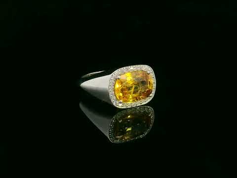 7.50 carat yellow sapphire men’s ring with diamond halo in 18K white gold by Emirates Diamonds Dubai