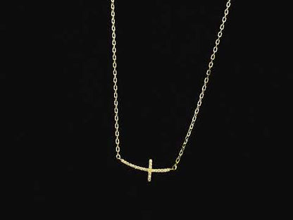 Diamond cross necklace in 18K yellow gold featuring 0.06 carats of diamonds by Emirates Diamonds.