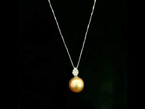 South Sea golden pearl and diamond pendant in 18K white gold featuring a 10 x 13 mm golden pearl and pear-shaped diamond detail.