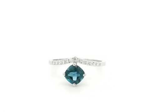 18K white gold London Blue Topaz ring featuring a 1.00 carat oval London Blue Topaz with 0.18 carat natural diamond accents on an elegant diamond-set band.