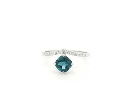 18K white gold London Blue Topaz ring featuring a 1.00 carat oval London Blue Topaz with 0.18 carat natural diamond accents on an elegant diamond-set band.
