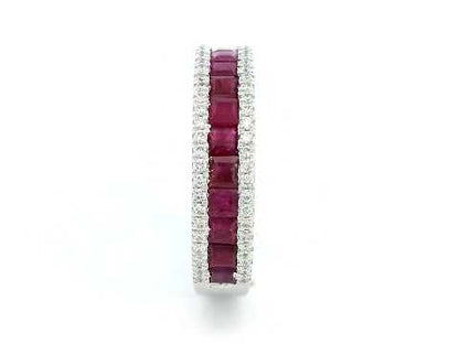 18K gold ruby and diamond ring with 1.36ct baguette-cut rubies and 0.26ct round diamonds in modern channel setting.