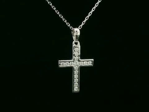 18K gold cross pendant with 0.20 carat round diamonds, religious charm on black background

