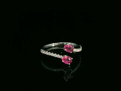 18K white gold open bypass ring with oval ruby gemstones and pavé diamond accents – fine ruby and diamond jewelry by Emirates Diamonds.