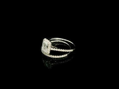 Emerald cut diamond bridal set in 18K white gold with GIA certified centre diamond, halo engagement ring and matching diamond wedding band