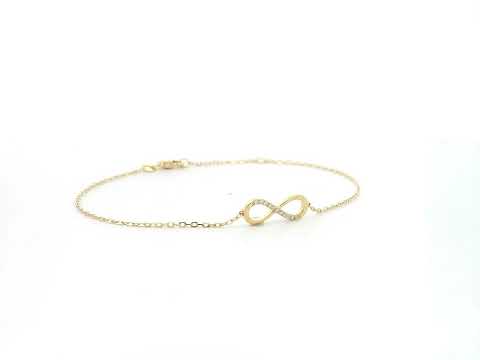 Diamond infinity bracelet in 18K yellow gold with 0.05 carat natural diamonds by Emirates Diamonds.