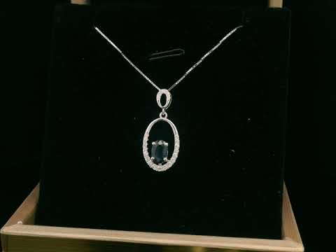 18K white gold oval pendant featuring a 0.70 carat sapphire with 0.15 carats of diamonds