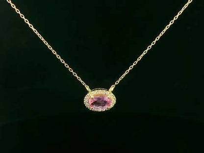 18K yellow gold pink sapphire and diamond halo necklace – 0.75ct sapphire with 0.10ct diamonds by Emirates Diamonds