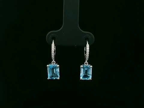 18K white gold hoop drop earrings featuring emerald-cut Swiss Blue Topaz and diamond accents by Emirates Diamonds.