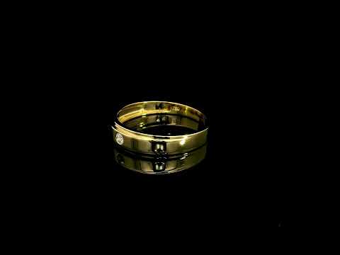 Men's 18K yellow gold band featuring a single round flush-set diamond, polished finish and fine grooved detailing.