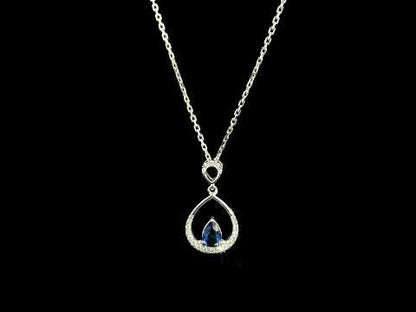 Pear shaped blue sapphire and diamond teardrop pendant in 18K white gold without chain