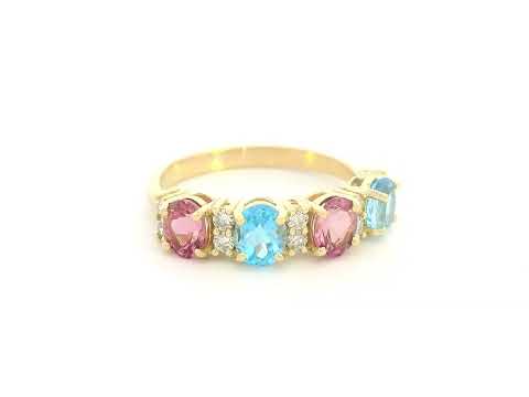 18K yellow gold band with alternating oval pink and blue sapphires and round diamond accents