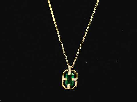 Emerald cut emerald geometric pendant necklace in 18K yellow gold with diamond accents