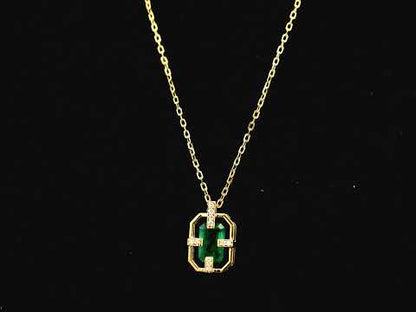 Emerald cut emerald geometric pendant necklace in 18K yellow gold with diamond accents