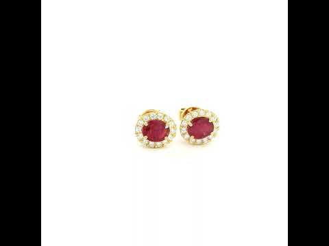 18K yellow gold natural ruby diamond halo stud earrings featuring round rubies surrounded by brilliant natural diamonds.