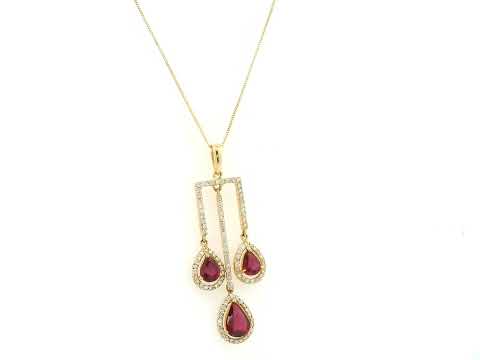 18K yellow gold ruby drop pendant with pear-cut rubies and diamond halo detailing by Emirates Diamonds