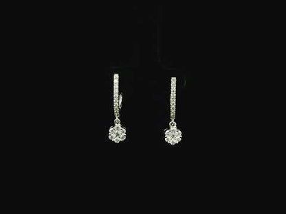 Diamond drop hoop earrings in 18K white gold featuring 0.59 carats of diamonds by Emirates Diamonds.