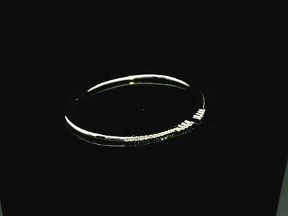 18K white gold diamond bangle featuring 0.54 carat natural diamonds in an elegant open bangle design.