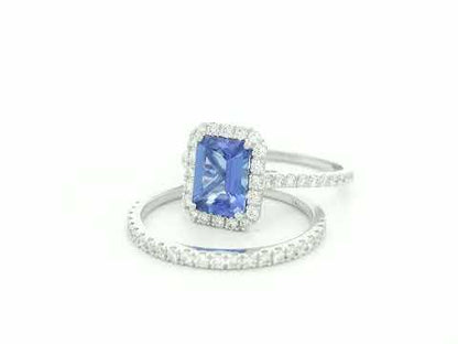 18K white gold tanzanite and diamond bridal ring set with halo engagement ring and diamond wedding band by Emirates Diamonds