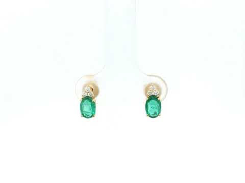 Emerald and diamond drop earrings in 18K yellow gold featuring 0.78 carat emeralds and 0.07 carat diamonds by Emirates Diamonds.