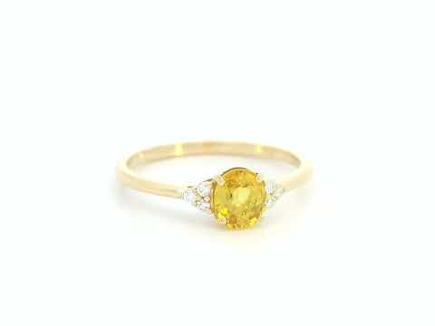 18K yellow gold ring with oval yellow sapphire and diamond accents, elegant gemstone ring by Emirates Diamonds