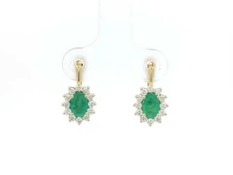 18K yellow gold emerald and diamond halo earrings featuring oval-cut emeralds surrounded by brilliant diamonds by Emirates Diamonds.