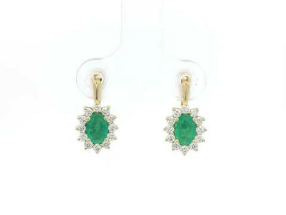 18K yellow gold emerald and diamond halo earrings featuring oval-cut emeralds surrounded by brilliant diamonds by Emirates Diamonds.