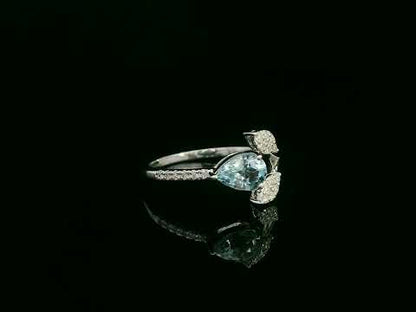 18k white gold ring with 0.69ct pear aquamarine & 0.15ct diamond-accented leaves – certificate included