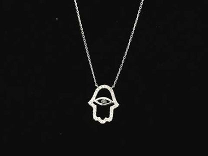 Diamond Hamsa evil eye pendant necklace in 18K white gold with black diamond center by Emirates Diamonds